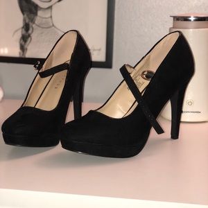 Black Mary Jane pumps.